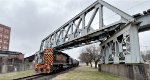 WE 7008 crosses under the abandoned A&BB RR bridge.